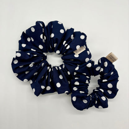 Blackberry Dot polka‑dot scrunchie duo. Deep navy blue with white spots, 100% cotton fabric hair accessory, handmade in Kent UK, cottagecore style, lovely gift for her