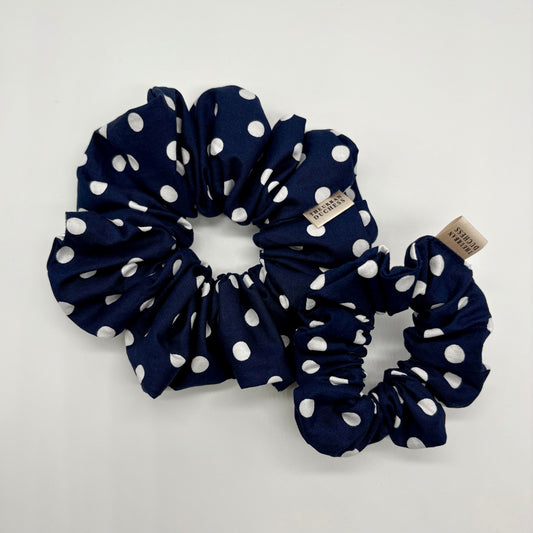 Blackberry Dot polka‑dot scrunchie duo. Deep navy blue with white spots, 100% cotton fabric hair accessory, handmade in Kent UK, cottagecore style, lovely gift for her