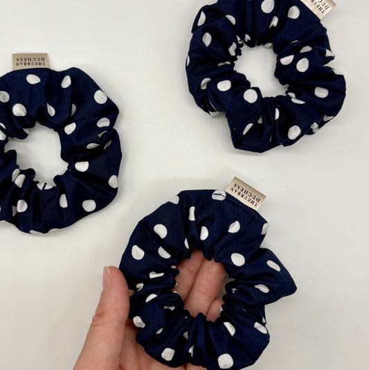 Blackberry Dot mini polka‑dot scrunchies. Deep navy blue with white polka‑dot print, 100% cotton fabric, handmade in Kent UK, teacher gifts, small treat or stocking filler.