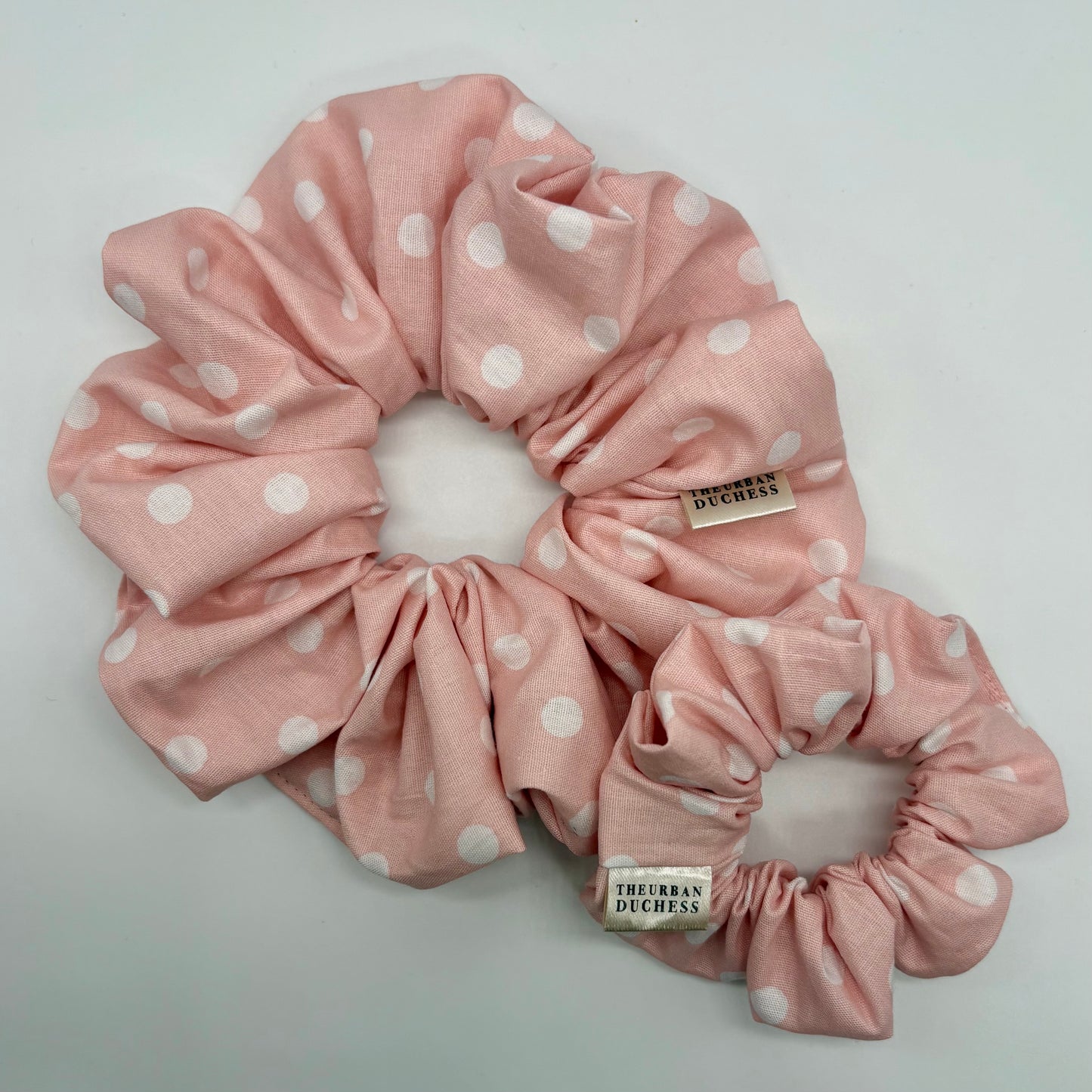 Blush Dot polka‑dot scrunchie duo. Oversized and mini, soft blush pink with white spots, 100% cotton hair accessory, handmade in Kent UK, cottagecore style,  gift for her