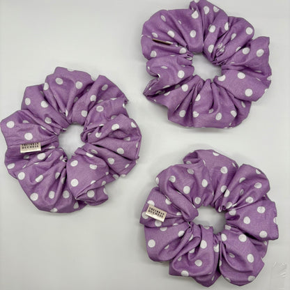 Lavender Dot oversized polka‑dot scrunchies. Soft lavender purple with white polka dot print, 100% cotton fabric, handmade in Kent, handmade in the UK, handmade hair accessories, birthday gift or teacher gift