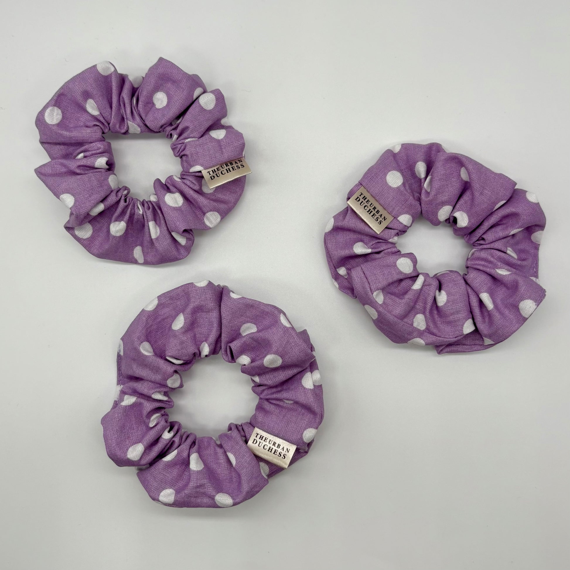 Lavender Dot Mini polka dot scrunchies. Soft lavender purple with white polka dot print, 100% cotton fabric, handmade in Kent, handmade in the UK, handmade hair accessories, small gift or stocking filler