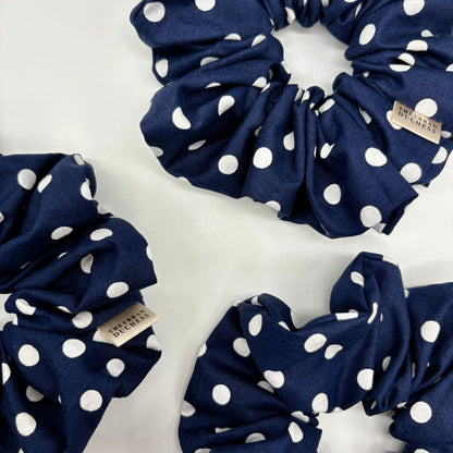Blackberry Dot oversized cotton scrunchie. Deep navy blue with crisp white polka dots, 100% cotton fabric, handmade in Kent, UK, gentle on all hair types, timeless countryside style