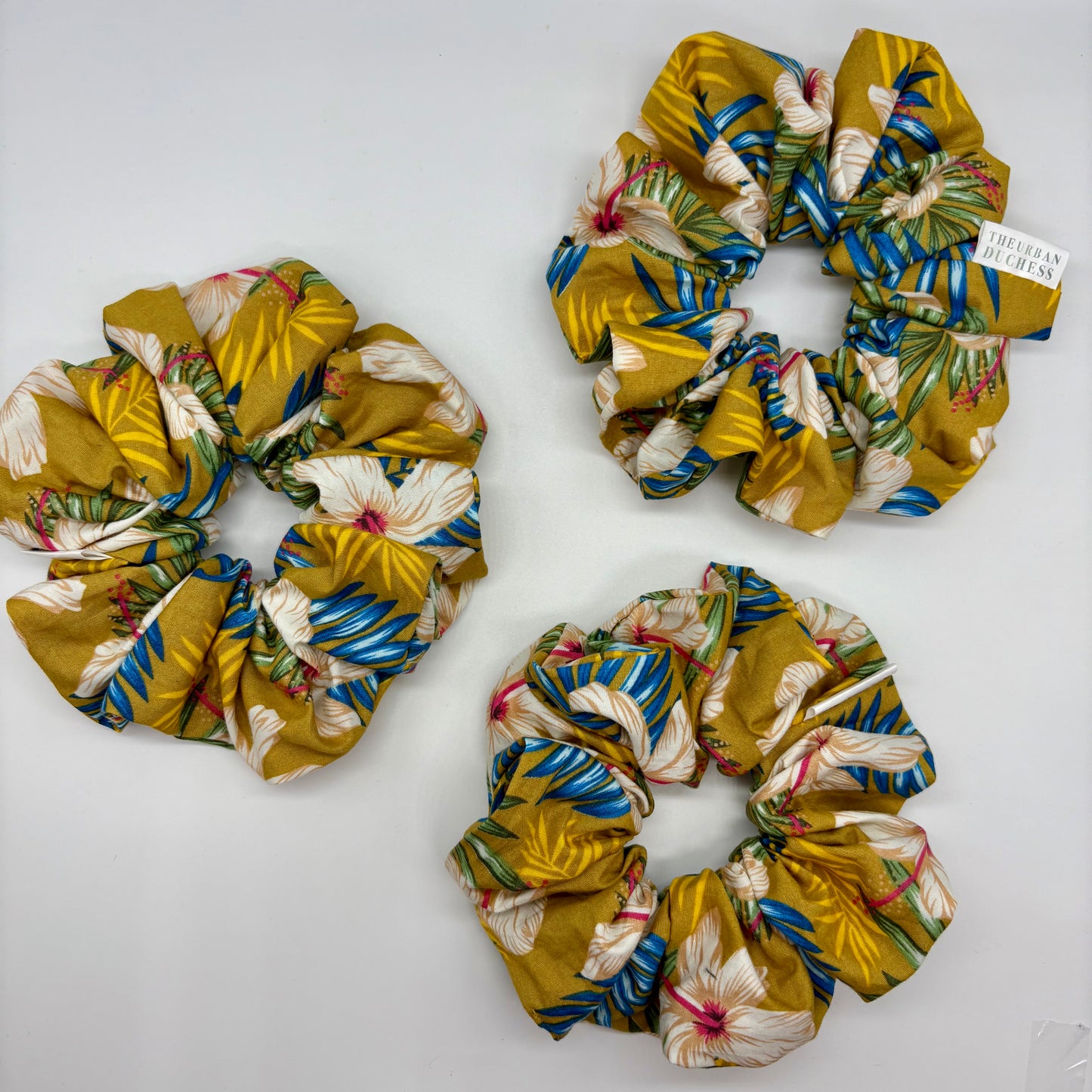 Hibiscus Sun oversized scrunchie. Bright yellow tropical floral design, Yellow floral print. 100% Cotton fabric cotton, handmade in the UK, ideal as a birthday or holiday gift.