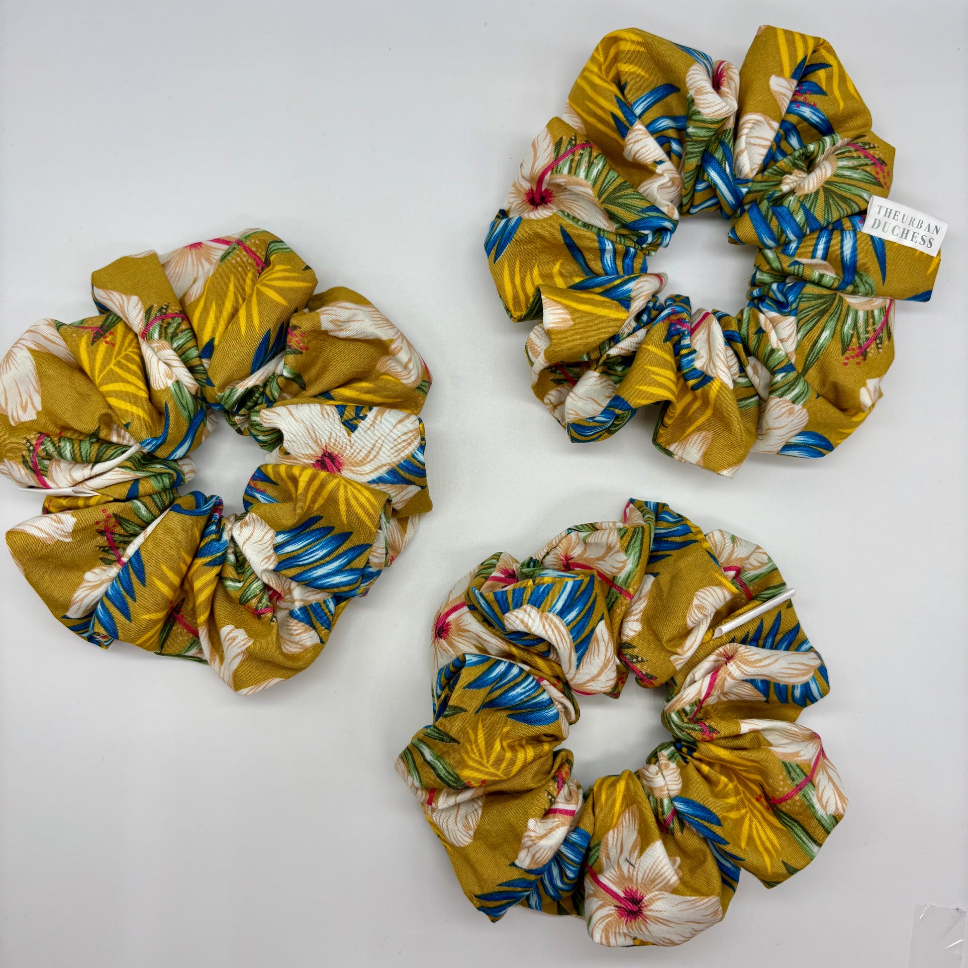 Hibiscus Sun oversized scrunchie. Bright yellow tropical floral design, Yellow floral print. 100% Cotton fabric cotton, handmade in the UK, ideal as a birthday or holiday gift.